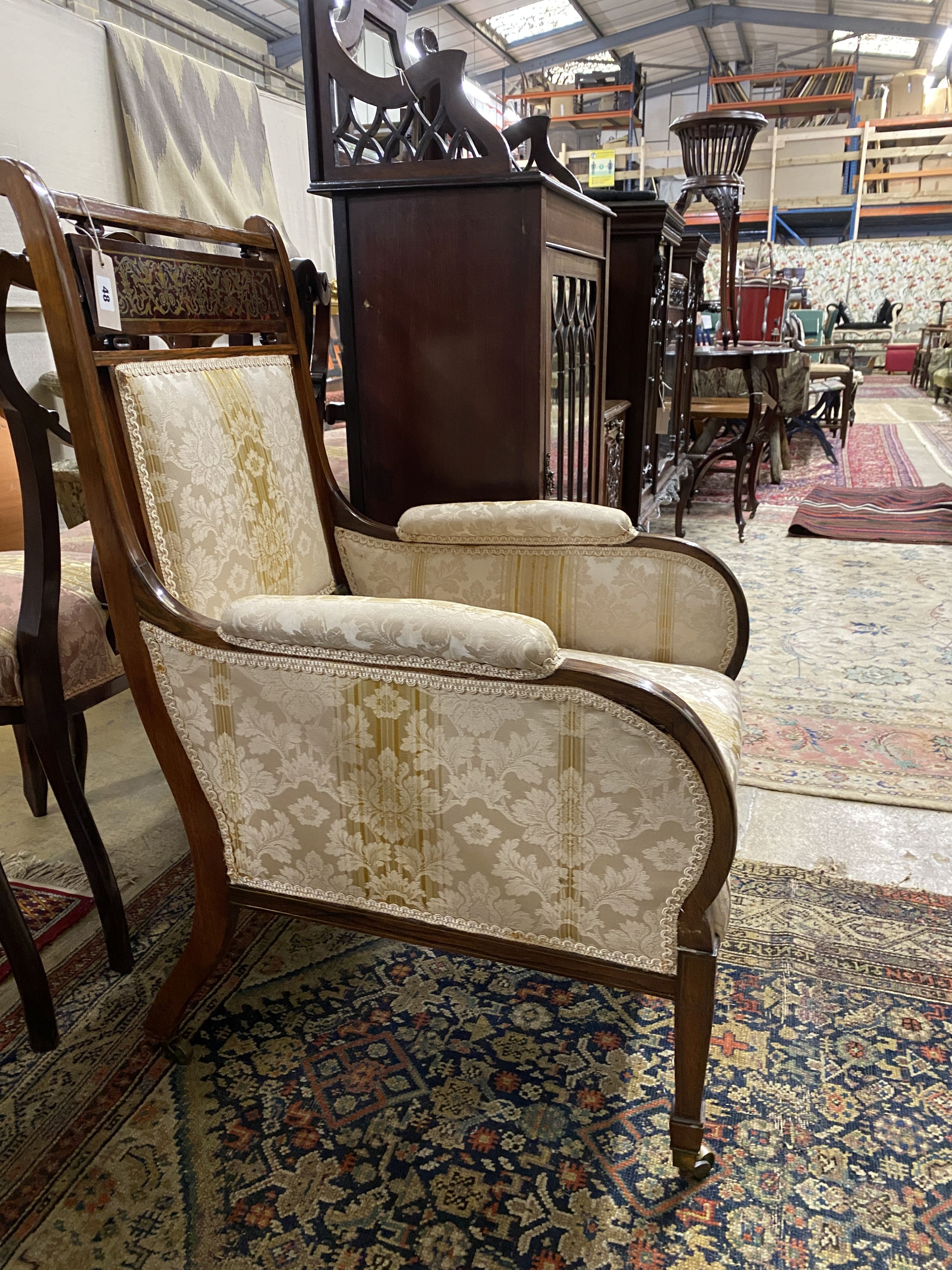 An Edwardian brass inlaid and boulle work rosewood upholstered armchair, width 60cm, depth 60cm, height 96cm